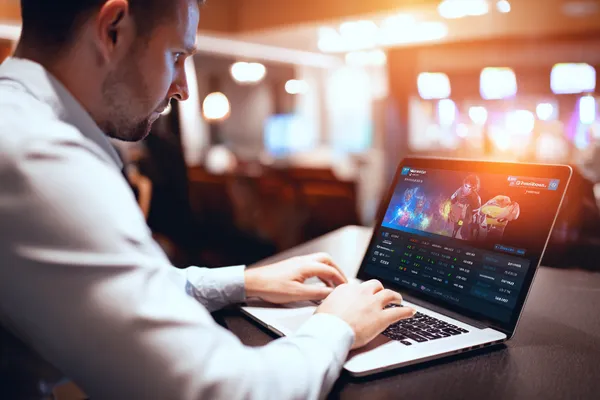 A person using their device against a moody casino-themed background, illustrating the smooth re-entry process at 599JILI.